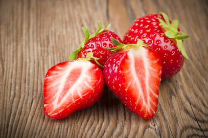 Fresh Strawberry close up on the wood