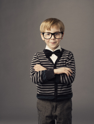 boy in funny glasses, little child fashion studio portrait