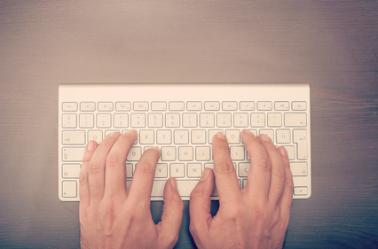 Man typing at the keyboard